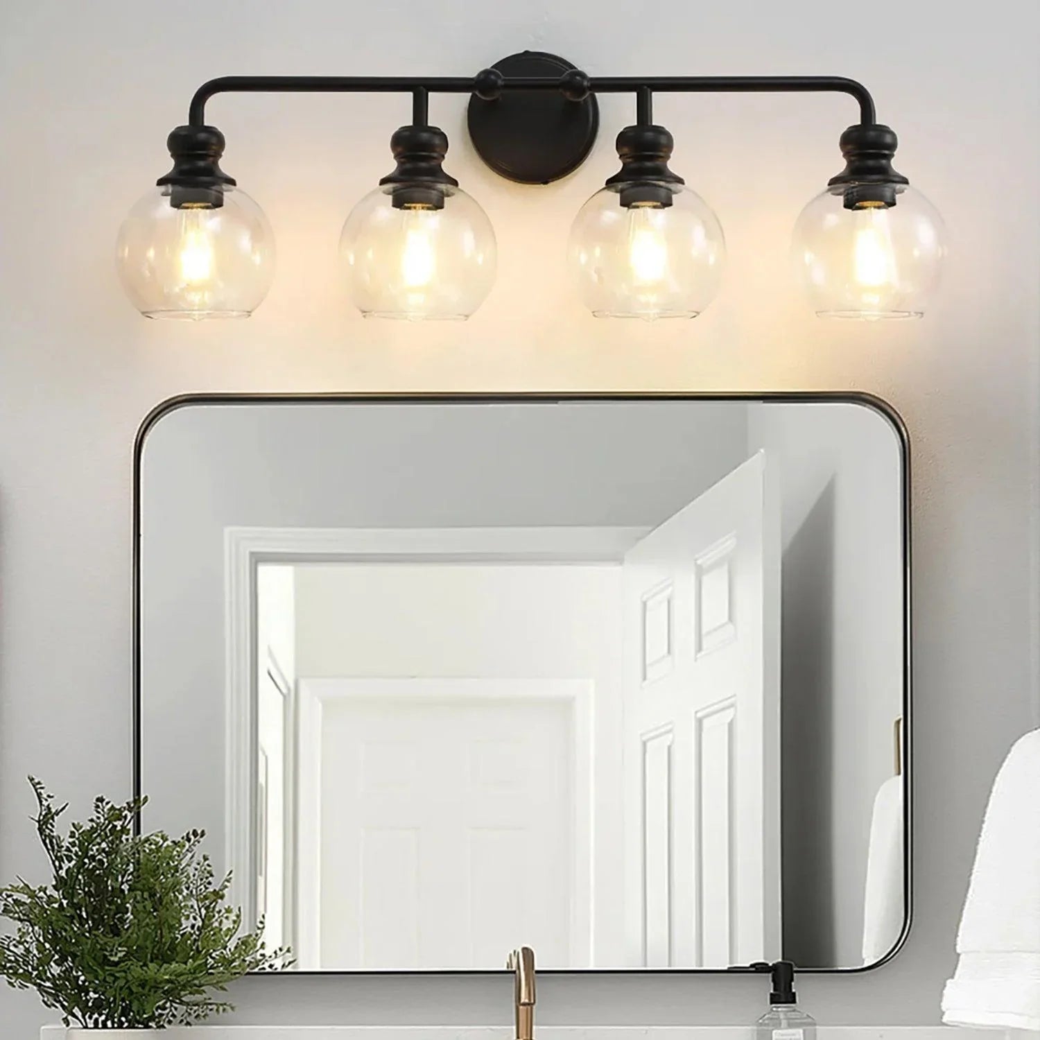Lámpara de tocador moderna Irvine de 4 luces de vidrio transparente negro