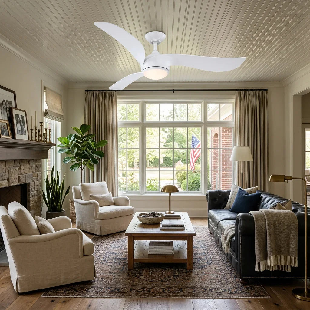 Modern white ceiling fan with integrated light fixture on a white paneled ceiling