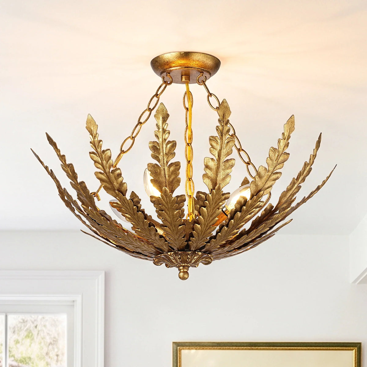 Gold leaf-shaped chandelier light fixture with a rustic metallic finish