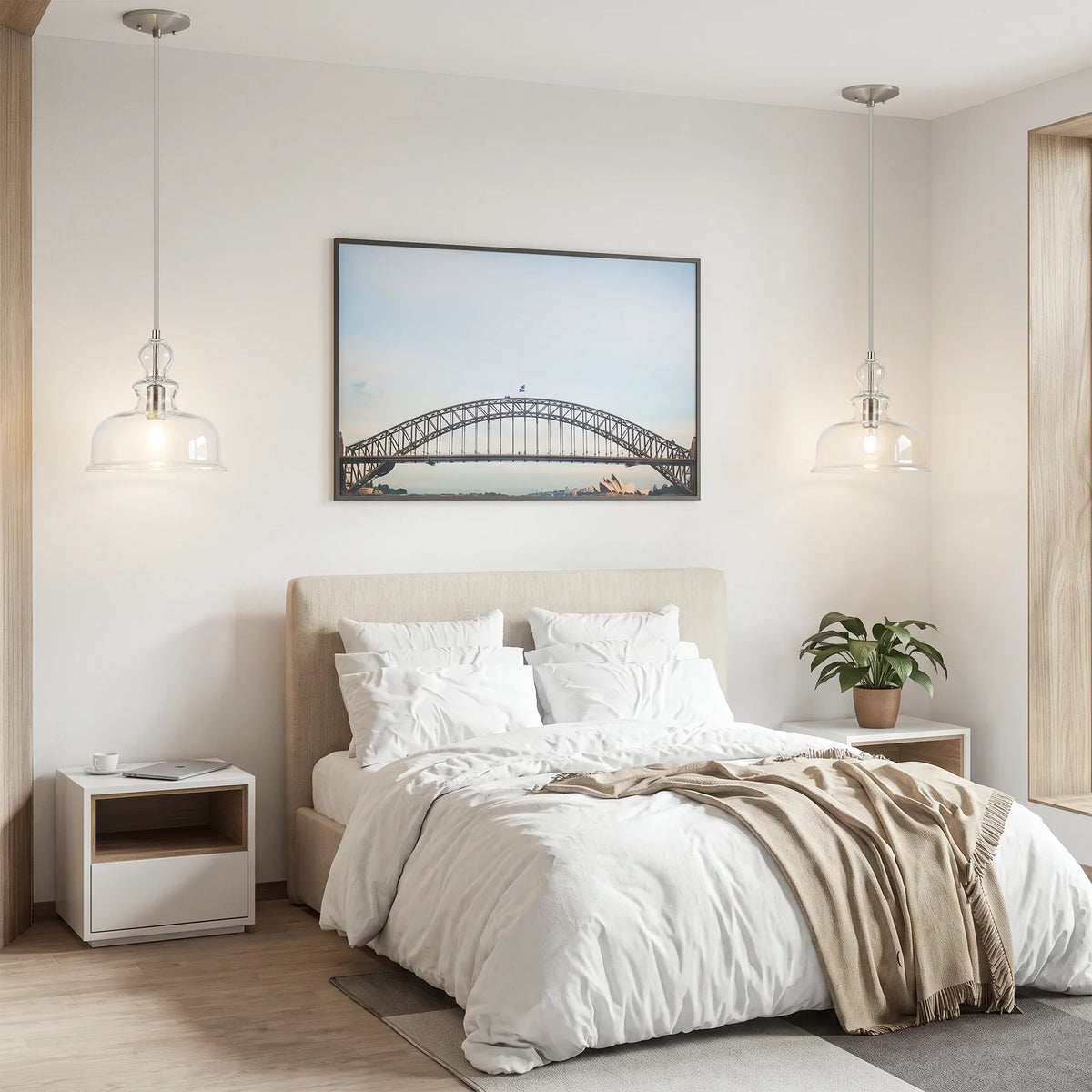 Modern bedroom featuring two glass pendant lights and a framed bridge artwork over a white bed.